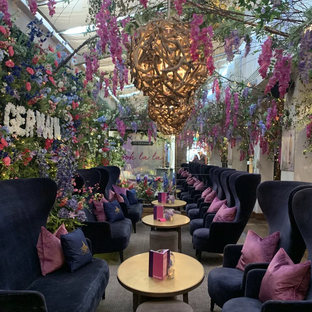 A St-Germain lounge hung with wisteria and blossom
